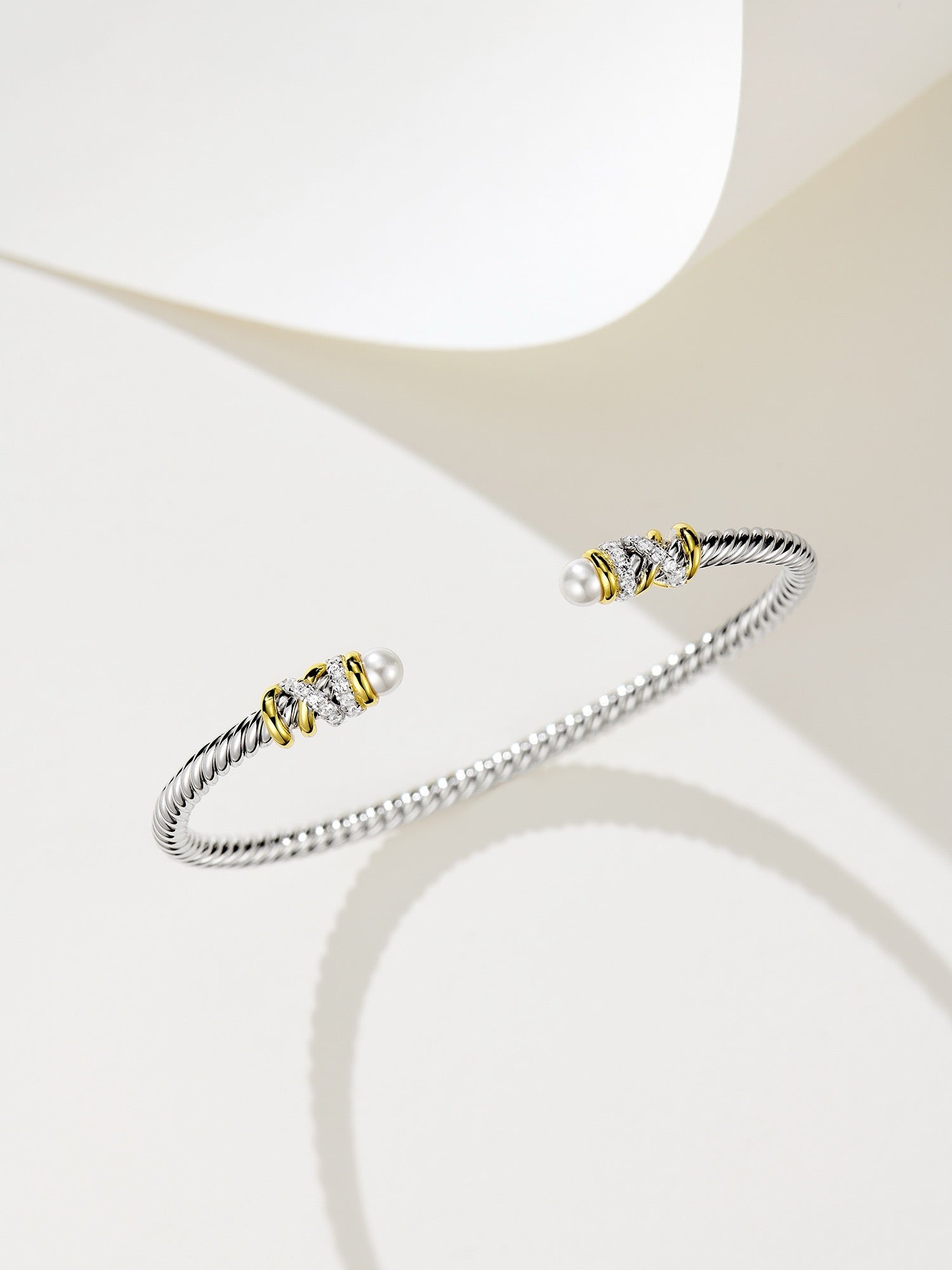 Elegant Silver Bracelet with Gold Plating, Swarovski Pearls, and Zirconia