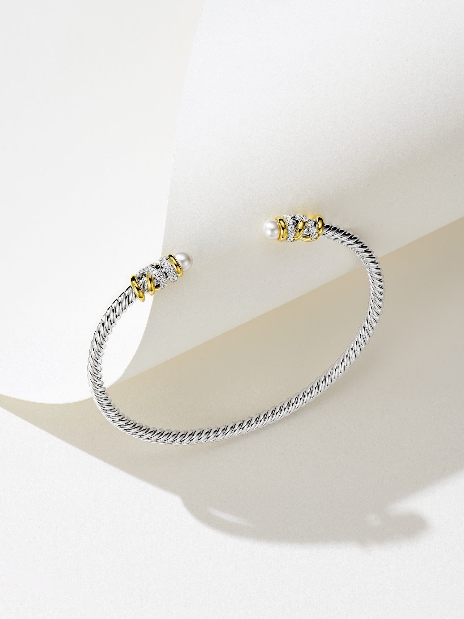 Elegant Silver Bracelet with Gold Plating, Swarovski Pearls, and Zirconia