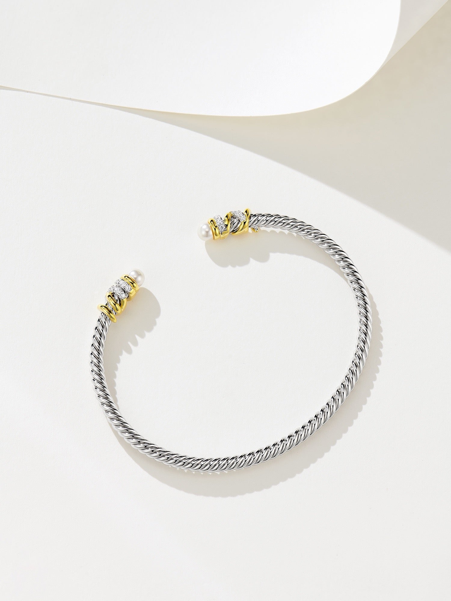 Elegant Silver Bracelet with Gold Plating, Swarovski Pearls, and Zirconia