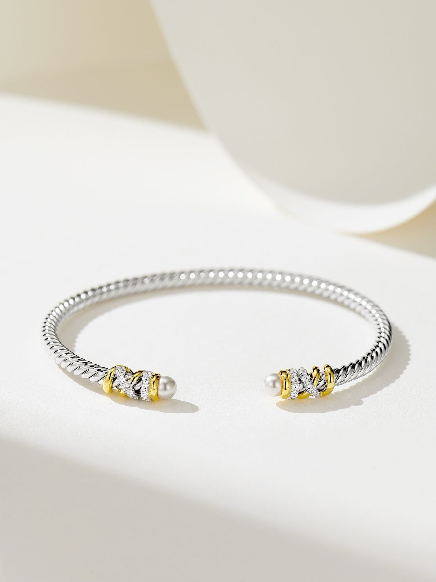 Elegant Silver Bracelet with Gold Plating, Swarovski Pearls, and Zirconia